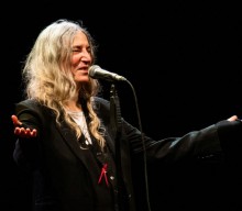 Patti Smith and Lenny Kaye perform ‘People Have The Power’ for voters in New York