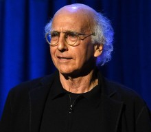 Larry David seen plugging his ears at New York Fashion Week in viral clip