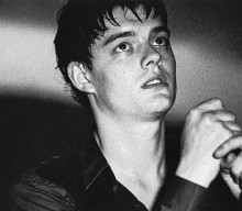 Sam Riley reflects on “pure fear” of playing Ian Curtis in ‘Control’