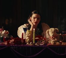 BENEE attends a moody medieval banquet in her new video for ‘Happen To Me’