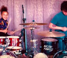 Watch Matt Helders and Nandi Bushell rip through Arctic Monkeys’ ‘Brianstorm’ on drums