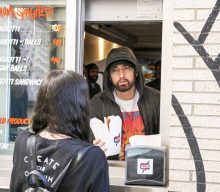 Eminem surprises fans at opening of Mom’s Spaghetti restaurant in Detroit