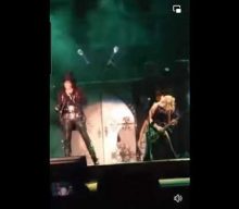 NITA STRAUSS Gets Hit In Head By Flying Broken Cane Piece During ALICE COOPER Concert (Video)