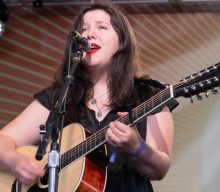 Watch Lucy Dacus perform from a couch due to herniated discs