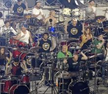 Watch over 1,000 musicians pay tribute to Taylor Hawkins with ‘My Hero’ performance