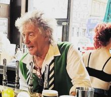 Rod Stewart surprises pub-goers by pulling pints behind the bar
