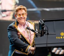 Elton John says he’s “in top health” after being spotted in a wheelchair