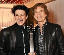 Mick Jagger presents Yungblud with special guitar at Rolling Stones show